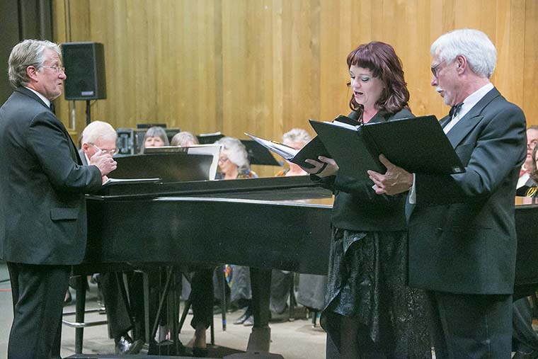 From left, Dwight "Buzz" Holmes conducts Marja Liisa Kay and Marshall Smith as they sing "See Nature Rejoicing" from "Come Ye Sons of Art". Photo by Jenny Kirchner