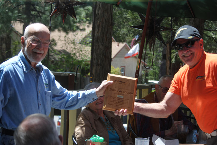 Fire Safe Council thanks Patterson: Friday at La Casita, Chris Kramer (right), Mountain Communities Fire Safe Council president, presented a plaque thanking Don Patterson, who is retiring, for his work as MCFSC project manager. Photo by J. P. Crumrine 