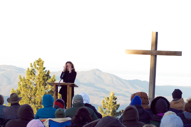 Kasaan Hammon, sharing her testimony, stands before the crowd during the Easter Sunrise Service at Inspiration Point. Photo by Gallagher Goodland