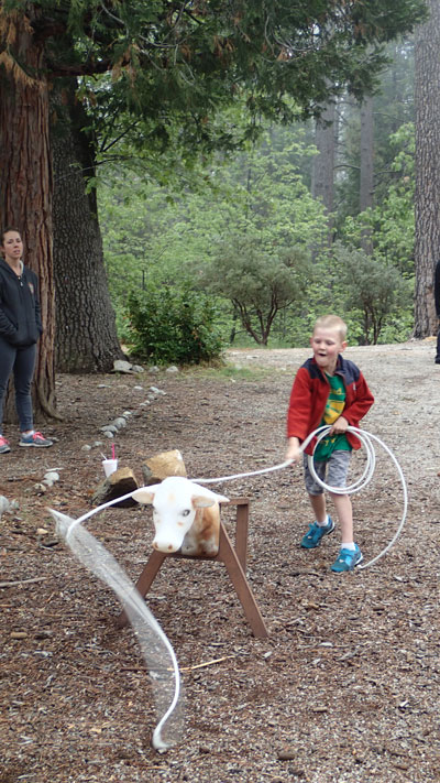 Seth White practices his lasso technique during the Idyllwild Assembly of God’s Community Fun Day at the Idyllwild Community Park. The free event last Saturday included live music, giveaways, a petting zoo and treats. Photo by Halie Wilson 