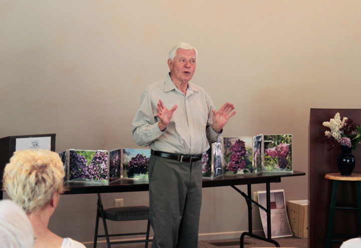 The first Lilac Festival continued Sunday at the Caine Learning Center, where Coordinator Gary Parton welcomes the visitors to the event “A Lilac in Every Garden” with poetry by Doug Austin. Photo by John Drake 