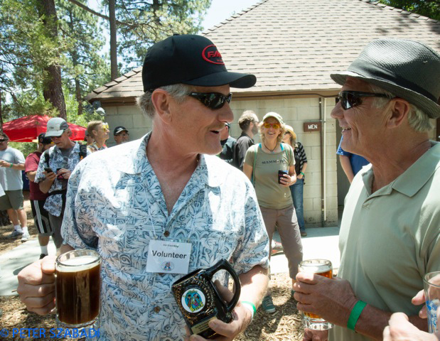Chris Austin (left), winner of the Men’s Stein Holding Contest, talks about his technique with runner-up Bob Baker. Photo by Peter Szabadi