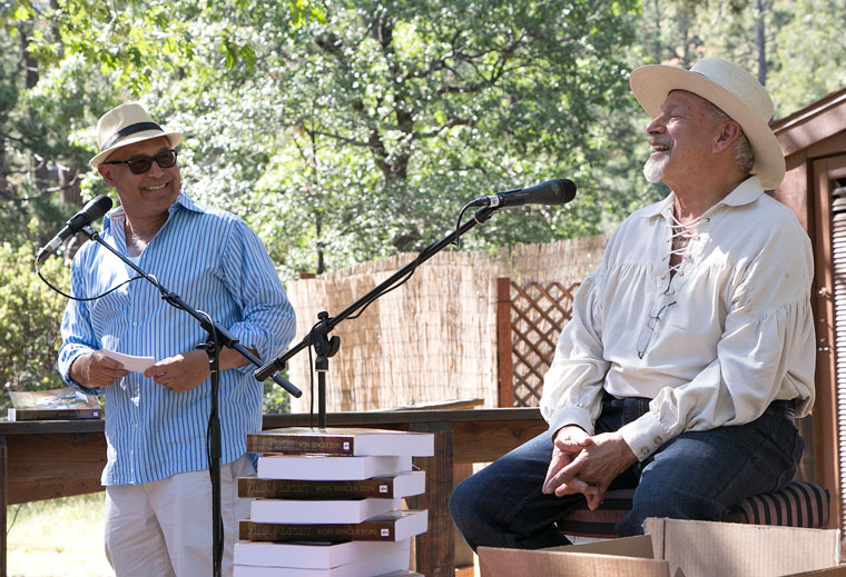 At Cafe Aroma Sunday afternoon, Eduardo Santiago (left) talks with Idyllwild local Ron Singerton about his novel “Villa of Deceit,” which is about ancient Rome. Photo by Jenny Kirchner 