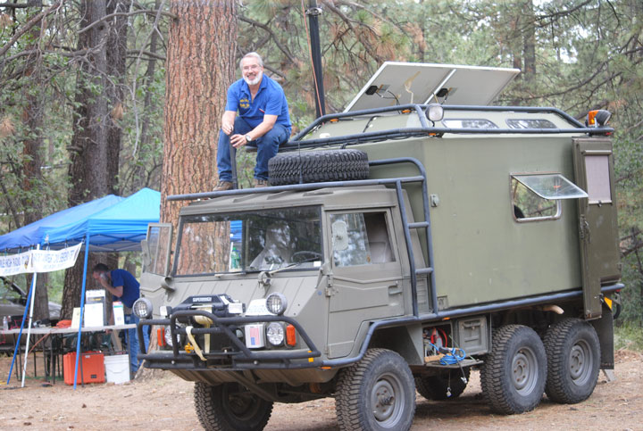 Mile High Radio Club hosts field day Jim Mettler of Idyllwild on his Pinzgaurer radio communications platform, works on the antenna last Saturday morning as the Mile High Radio Club was setting up for its annual Field Day. MHRC communicated with other clubs through the western United States: from Utah west to Hawaii and from Washington south to Arizona. Photo by J.P. Crumrine 