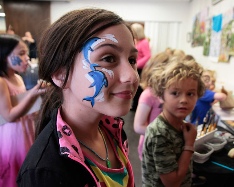 Summer Reading Success: Colin Savage looks on as Hannah Johnson shows her dolphin smile during the “We Will Rock You” party at the Idyllwild Library. This event concluded the successful Summer Reading Program. This year’s theme was “Reading to the Rhythm” where kids were treated each week to a special guest that taught them a new song or dance and a fun story. This week marked the end of this season with the premiere of the “What does the Fox Say” video. Photo by John Drake