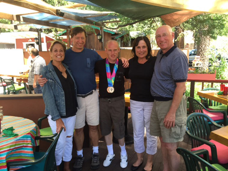 Three Hill residents at Tommy’s Kitchen recently welcomed and congratulated Adrian Abbott (center) from Llantwit Major, Wales, on winning Special Olympics medals. From left, Patti Cooper, Steve Taylor, Adrian, Denise McGregor and Adrian’s father Anthony Abbott, also of Wales. Adrian is part of the Great Britain Kayaking Team and won a Bronze Medal in the individual 500 meter kayaking event and a Silver Medal in the individual 200 meter kayaking event. Photo courtesy Denise McGregor 