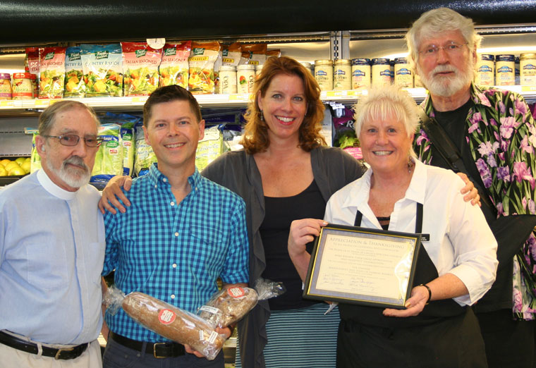 St. Hugh’s Episcopal Church provides free warm lunches every Thursday to anyone who needs them. More than 850 meals have been served since the program began, usually serving 10 to 20 people a week thanks to the food donations of Diane Johnson of Fairway Foods and bread donations of Brewster Tapp of Strawberry Creek Bakery. In appreciation, Diane was presened a plaque last Wednesday at Fairway. From left, Fr. Dan Rondeau, Brewster, Christina Nordella, who started the program, Diane and Neil Passage. Fr. Dan and Neil continue the program Christina started.Photo by Becky Clark