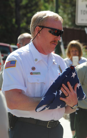 Idyllwild Fire Chief Patrick Reitz prepares to have the flag raised to concluded the 9-11 ceremony.