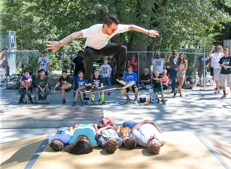 Zac Archuleta of Orange County and part of The Lost Boys Project, jumps over five people as fellow skaters watch on in awe last Saturday at the Idyllwild Skate Park. The Lost Boys Project’s vision is to provide an awesome, safe environment to build up, mentor and develop students in their academic and daily life, and spiritual journey in their Christian faith. Photo by Jenny Kirchner