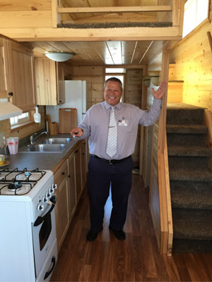 Scott Sirois, Soboba Casino general manager, is pictured here inside and with the key to the tiny home that will be given away this September in the casino’s promotion “Tiny Home, Giant Free Play.” The grand prize is a tiny home built by Rich’s Portable Cabins and that will be featured in an upcoming episode of HGTV’s program “Tiny House Hunters.” Photo courtesy Soboba Casino