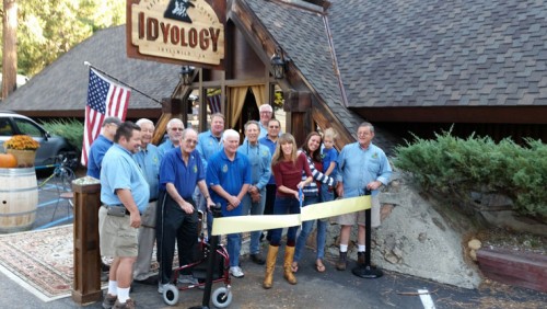 Windean Dahleen, owner of Idyology, holds the scissors for a Idyllwild Rotary ribbon cutting, The Idyllwild Rotary helped Dahleen celebrate the restaurant’s first anniversary.Photo by Thom Wallace 