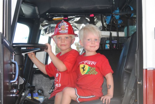 Jens and Kimi Hansen of Idyllwild enjoy their view from the driver’s seat of the Idyllwild Volunteer Fire truck during the open house Saturday. Photo by JP Crumrine 