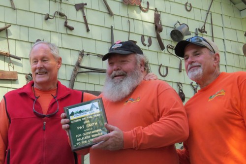 Last Friday, the Mountain Communities Fire Safe Council Board of Directors hosted its annual recognition luncheon for the Woodie volunteers. Pat Smith (center) was honored as the 2015 Citizen of the Year. The recipient of this annual award is selected for “Outstanding Selfless Service to the Community.” Pictured with Smith are Bob Royer (left), the 2014 award recipient, and MCFSC President Chris Kramer. Photo by Doris Lombard 