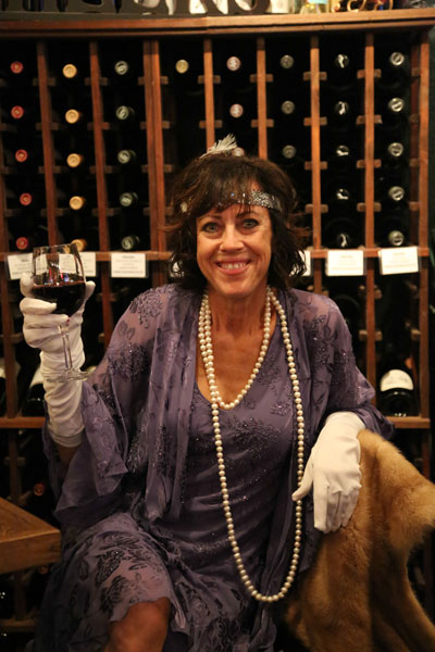 Jac Jacaruso performs while this flapper from the 1920s seems to be flaunting Prohibition while enjoying the Hall-O-Wine party at Idyll Awhile Wine Shoppe & Bistro Saturday night. Photos by Cheryl Basye 
