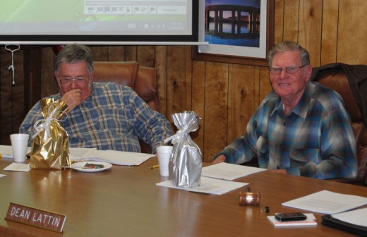 Warren Monroe (left) and Dean Lattin (right) admire the gifts of recognition for their service as directors of Idyllwild Water District. The Nov. 18 session was their last formal meeting before their terms expire in early December. Photo by JP Crumrine 