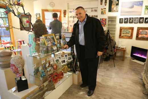 On Friday, Nov. 6, Jerry Baccaiare (shown) proudly hosted the grand opening of Jerry Art, his new gallery in Oakwood Village.Photo by Cheryl Basye 