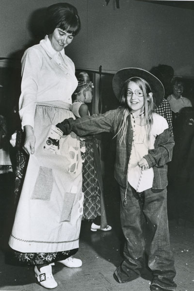 In 1972, Terry Leih (right) picks the pocket of pocket lady Kathy Beane at the annual Halloween Carnival.File photo 
