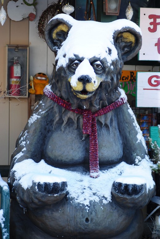 With a gesture of abundance, the bear outside the BBVA bank was satisfied with the snow covering it received the night before.