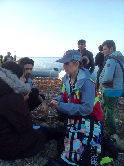 Idyllwild resident and practicing attorney Mary A. Lehman is seen here on the Greek island of Lesbos assisting arriving refugees from Syria and Iraq. Lehman joined volunteers from all over the world who just showed up because they felt compelled to do so. Lehman was an emergency medical technician before becoming an attorney. Photo courtesy of Mary Lehman
