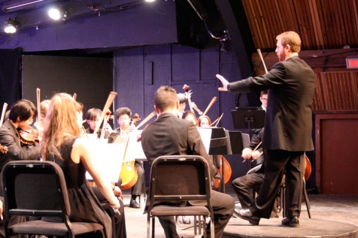 Timothy Verville conducts the Idyllwild Arts Academy Orchestra in Arvo Part’s “Wenn Bach Bienen gezüchtet hätte (If Bach Was a Bee Keeper)” at Sunday’s concert at the IAF Theatre on campus. The orchestra also performed Saturday night. Photo by becky Clark 
