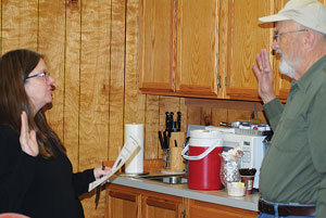 Becky Smith (left), Pine Cove Water District secretary, administers the oath of office to Director Tim Lange, who was elected to a full four-year term in August. Photos by JP Crumrine 