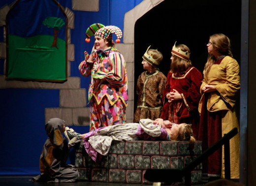 The Missoula Children’s Theatre returned to Idyllwild School last week to produce “Sleeping Beauty,” performed Friday and Saturday in the Idyllwild School gym with all of the cast except the Jester Idyllwild School students. The students auditioned Monday and performed less than a week later. Here (from left) are Andrea Rackley as “Spot,” Whitney Brennan Ward, the tour actor and director, as “Jester” Emma Righetti as “Sleeping Beauty,” Adam Smith as the “King,” Tegan White as the “Queen” and Peyton Manchee as the “Lady in Waiting.”Photo by John Drake 