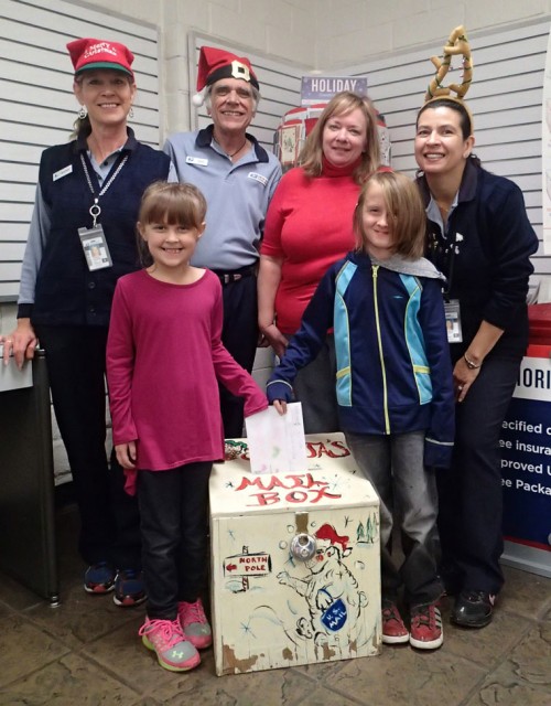 Evelyn and Carter Johnson are the first to drop their letters to Santa in the box bound for the North Pole. Santa’s helpers are (from left) Sherry Kaufman, John Aussenhofer, Postmaster Kelly Gates and Christina Reitz. The mailbox will be in the Idyllwild Post Office lobby until Friday, Dec. 18, for children to send Santa their Christmas wishes. Santa allows the Town Crier to print the letters in the Christmas edition for readers to enjoy. Photo by Halie Wilson 