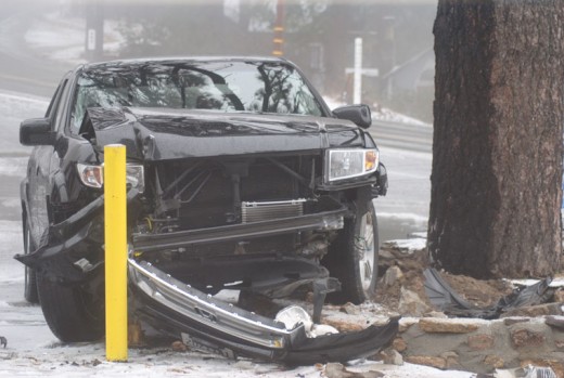 Once the snow began falling Friday near noon, traffic collisions began to occur throughout the Hill. One of the first was at the Pine Cove Market where this vehicle driving south on Highway 243 left the road and smashed into the barrier at the market. Photo by JP Crumrine 