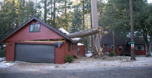 A large tree took out the garage and downed cable lines on Lodge Road at about 3:45 p.m. Saturday. No one was at the residence, and the house didn’t appear to be damaged. Photo by Jenny Kirchner 