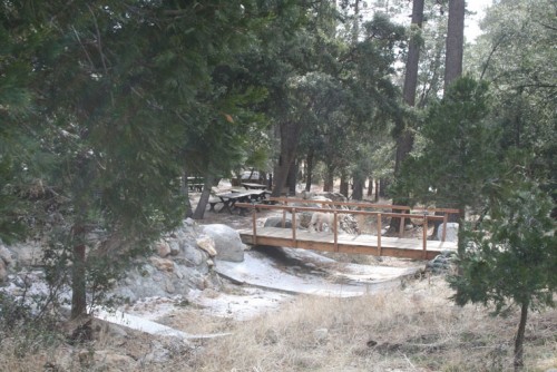 A newly constructed water course fortified with concrete and a walk bridge that can flip open into two sections to avoid water damage.Photo by Marshall Smith 