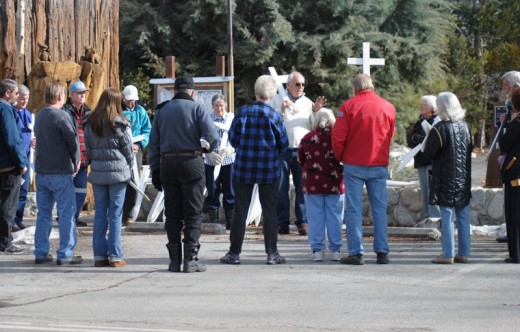 The U.S. Supreme Court’s decision to allow abortions, under certain conditions, was issued on Jan. 22, 1973. The following year, the first “March for Life” protest was held in Washington, D.C. On Jan. 21, local residents, including John Cook (center), gathered around the Tree Monument and walked to Queen of Angels Church. The white crosses were a symbol of many abortions since 1973. Photo by JP Crumrine 