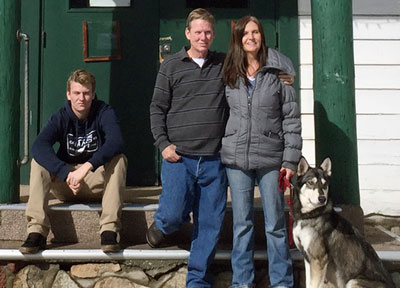 Idyllwild Assembly of God, a new congregation in town, meets temporarily in the chapel at Idyllwild Pines. It held its first Idyllwild service on Sunday, Jan. 10. Seen here are Pastor Mark Garrett (center), his son Sean (left) and wife Tina in front of the Idyllwild Pines Chapel. Also pictured is the Garretts’ dog Reyna. Photo courtesy Mark Garrett