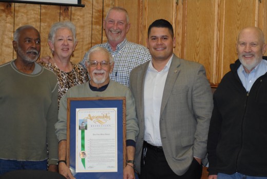 Jesse Ramirez (second from right), field representative for state Sen. Jeff Stone, presented a Distinguished District resolution to the Pine Cove Water District directors, (from left) Joel Palmer, Diana Eskew, Lou Padula (holding the proclamation), Robert Hewitt (president) and Tim Lange last Wednesday. Photo by JP Crumrine