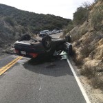 Overturned vehicle on Highway 74