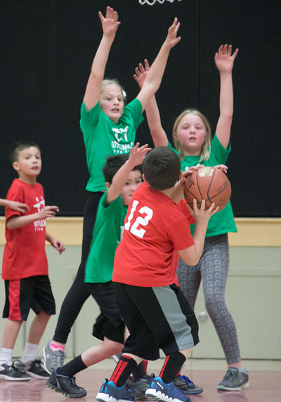 The Trojans (in red) and Wildcats (in green) play at Idyllwild School Tuesday evening. Photo by Jenny Kirchner 