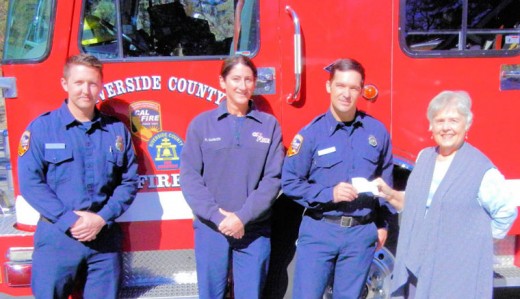 The Idyllwild Rotary Anns also gave a check to the crew at Cal Fire/Riverside County Fire Station 23 in Pine Cove. Accepting the check from Rotary Ann Roberta Corbin (far right) is Fire Apparatus Engineer Ryan Mileur, who is joined by other crew members, Matt Andersen (far left) and firefighter/paramedic Capt. Katherine Garver. The gift will be used for workout equipment and kitchen items. Photo courtesy Roberta Corbin 