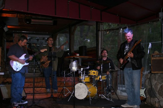 The Blue Swan Blues performed at Café Aroma Monday night to a receptive crowd. From left, Barry Baughn, Bill Saitta, Andy Fraga, Jr. and Don Reed. Photo by Becky Clark 