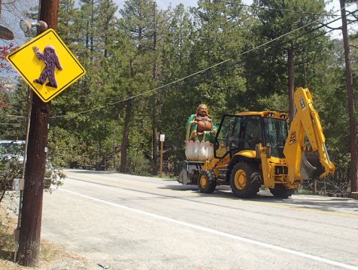 Buddha is towed up North Circle Drive from property across from the Idyllwild Community Center site on Highway 243 last week. Tow photo by Halie Wilson