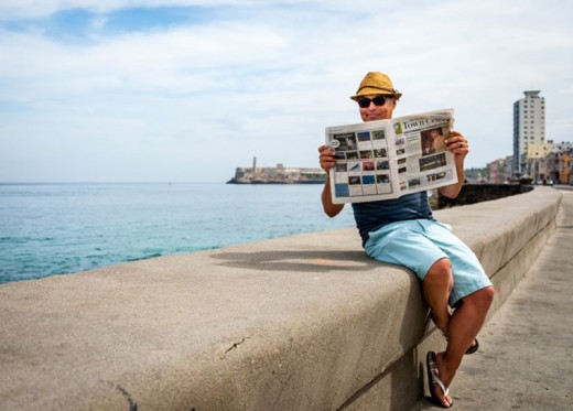 Eduardo Santiago and a group of friends were visiting and traveling in his native Cuba last week. Santiago sits with his Town Crier at the famous Malecon (seawall) of Havana, with Morro Castle, built in 1589, in the background. 