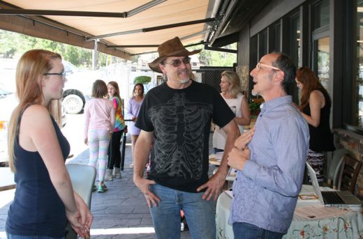 Holistic health practitioner Steven Morrison (right) mixed with interested attendees, including Julian Geisinger (center) at Sky Island Organic’s first Health Fair, held on Saturday, May 14. Photo by Marshall Smith 