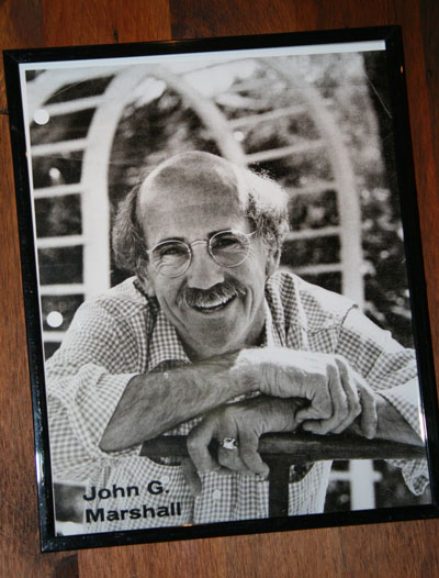 Beloved Idyllwild character and irreverent cartoonist John Marshall is seen in a photo at a permanent exhibition of his work at the Idyllwild Area Historical Society. Photo by Marshall Smith 