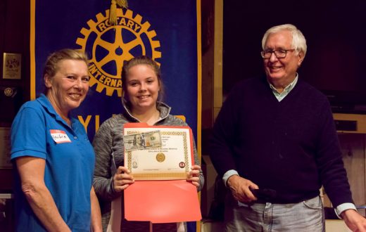 Emily Hill (center), accompanied by her mother Angie (left), received the Idyllwild Rotary Eighth-grade Citizenship Award and Scholarship from Scott Fisher (right) at the May 11 meeting of the Idyllwild Rotary Club. Emily’s teacher, Christy Tilley, described her amazing leap in maturity, responsibility and desire to succeed over her three years at Idyllwild School.       Photo by Tom Kluzak 