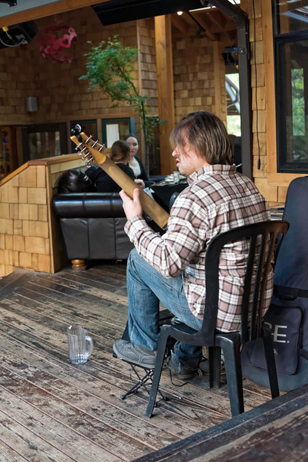 Cheyenne Womack entertained the patrons of the Aroma Café on Monday, May 23 with his solo guitar renditions, interesting quiet and provocative melodies that enhanced the dinner experience.  Photo by Tom Kluzak 