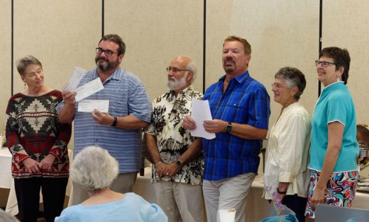 Jeffrey Dvorak (second from left), chair of the board of the Idyllwild Arts Foundation, is happy to receive three checks from the officers of the Associates of the Idyllwild Arts Foundation at its annual meeting Sunday, June 12. Officers of the Associates pictured (from left) are Linda Anderson, Dvorak, Terry Casella, President Michael Slocum, Annamarie Padula and Pam Goldwasser. Over the past year, the Associates have donated $41,000 for scholarships and to promote programs at the Academy. Photo by Tom Kluzak 