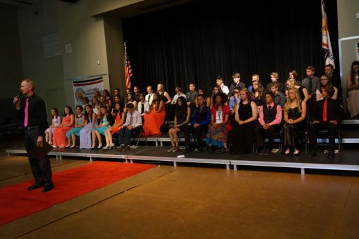 Bob Leih, middle school science teacher, presents the 8th grade class, which was promoted to high school on Tuesday evening, May 24. 