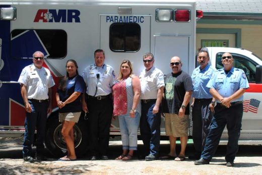 On its one-year anniversary, the American Medical Response crews had a  barbecue to celebrate their service to Pine Cove. Here (from left) are Jack  Hansen, AMR’s operations manager; Kim Brown, EMT; James Palmer, supervisor;  Anita Flaa, administrative assistant; Rod Parr, supervisor; Sebastian Vargas, EMT; Richard Alvarado, paramedic; and Pat Price, paramedic. Photo by JP Crumrine