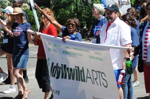 Pam Jordan, (center) president of the Idyllwild Arts Foundation, leads the Idyllwild Arts parade contingent.Photo by JP Crumrine 