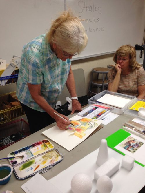 Barbara Parish demonstrates technique to student Sherri Domengoni during Saturday’s Art Alliance of Idyllwild Artist Workshop.  Photo courtesy of Shanna Robb