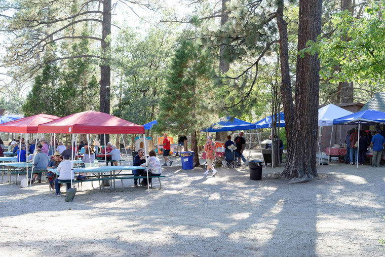 The Idyllwild Rotary Club held its annual Sunday before Labor Day Open Pit Barbecue on Sept. 4 in the Town Hall yard. A large crowd enjoyed the beef tri-tip roasted in a wood-fired open pit for 20 hours and served with a variety of sides, including coleslaw, baked beans and watermelon. Proceeds from the event will help fund the many Rotary projects and scholarships.Photo by Tom Kluzak