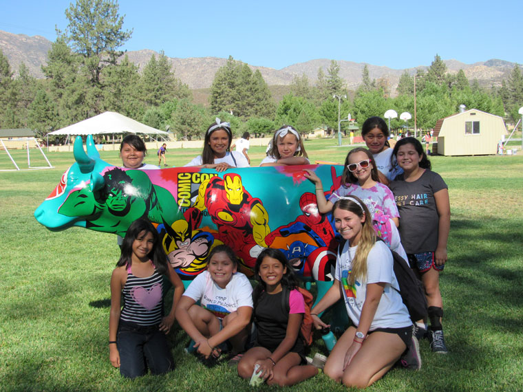 Brightly painted fiberglass cows raise campers’ spirits